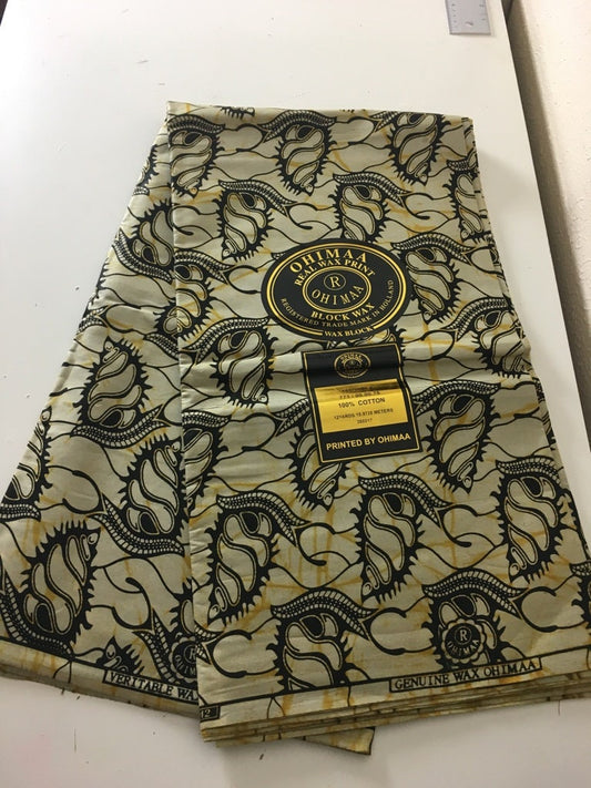 African fabric sold per yard. Beige and black Colour